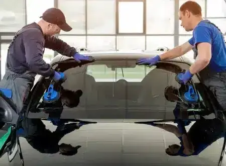 Certified technician repairing a chipped windshield in Anchorage, Alaska.